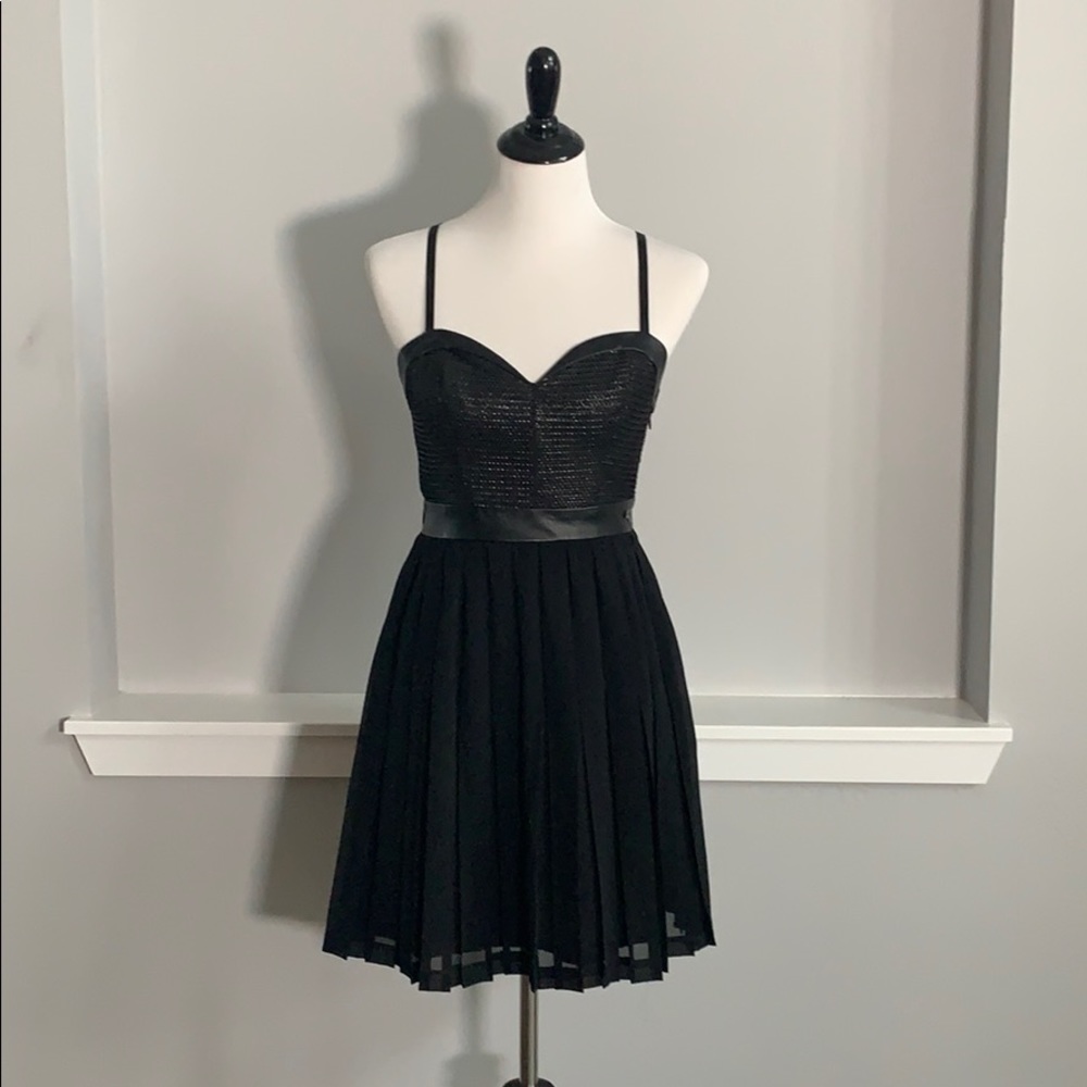 Sexy little black dress with leather belt and trim